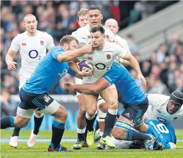  ?? AFP ?? England scrum-half Danny Care is tackled by Italy prop Lorenzo Cittadini, left.