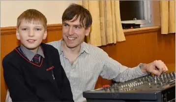  ??  ?? Eoin and John McIntyre looking after the sound desk at the launch of Féile na Tána held in St. Michael’s Hall, Carlingfor­d.