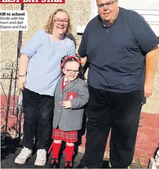  ??  ?? Off to school Eimile with her mum and dad Sharon and Paul