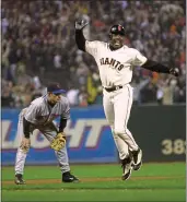 ?? ROBERT TONG — MARIN IJ ?? Barry Bonds reacts to J.T. Snow’s game tieing homer in the bottom of the ninth inning. In the background is third baseman Robin Ventura.