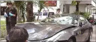  ??  ?? In this file photo frame grab from video footage shows police inspecting the Ferrari car belonging to Red Bull heir Vorayuth “Boss” Yoovidhya in Bangkok, after a hit-and-run case which resulted in the death of a police officer.