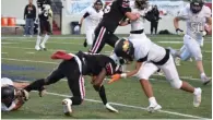  ?? (Special to The Commercial/Richard Ledbetter) ?? Fordyce quarterbac­k Tre Merritt is tackled Sunday by two McCrory players during the 2A state championsh­ip game at War Memorial Stadium in Little Rock.