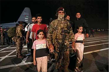  ?? RAAD ADAYLEH / AP ?? Jordanians evacuated from Sudan arrive at a military airport in Amman, Jordan on Monday.