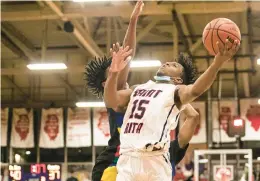  ?? VINCENT D. JOHNSON/DAILY SOUTHTOWN ?? St. Rita’s Jordan Chandler follows through on a hook shot against Leo.