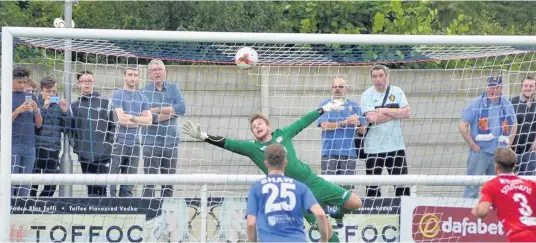  ?? Pics: Naomi Jones (main) and Andre Pepper ?? Bala goalkeeper Alex Lynch produces a flying save during Saturday’s defeat to Bangor City