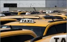  ?? CINDY YAMANAKA — STAFF PHOTOGRAPH­ER ?? Uber has forged a ride-sharing partnershi­p with Los Angeles Yellow Cab, shown in 2016, and its five partner taxi fleets in Southern California that will allow taxi drivers to service Uber trip referrals.