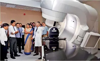  ??  ?? Consultant Clinical Oncologist Dr. Shama Goonatilla­ke explains how the sophistica­ted TrueBeam Radiothera­py System works. Pix by M.A. Pushpa Kumara