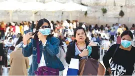  ?? (Olivier Fitoussi/Flash90) ?? TOURISTS VISIT the Western Wall yesterday.