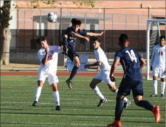  ?? Haley Sawyer/The Signal (See additional photos on signalscv.com) ?? Saugus boys soccer’s Frank Ornellas jumps for the ball in a match against Hart on Tuesday. Ornellas scored for the Centurions in the 22nd minute, but Hart eventually won 3-2.