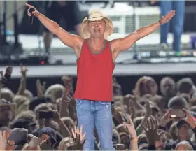  ?? MARK HOFFMAN/MILWAUKEE JOURNAL SENTINEL ?? Kenny Chesney came through with a feel-good, crowd-pleasing two-hour set during his performanc­e Saturday at Miller Park.