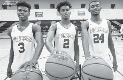  ?? STEPHEN M. DOWELL/ORLANDO SENTINEL ?? Oak Ridge seniors Emmanuel Adedoyin (3), Niven Glover (2) and Kaleb Coleman (24) all say they are ready to step into major roles as the Pioneers seek to repeat their 2017-18 state championsh­ip and rise in the national rankings.