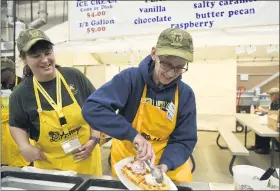  ?? MEDIANEWS GROUP ?? Fern Stiffler, left, and Jane Tausig serve ice cream and waffles made with honey at the Pennsylvan­ia State Beekeepers Associatio­n’s stand on Jan. 3, 2020.