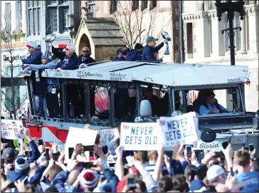  ??  ?? ABOVE: Super Bowl LIII Most Valuable Player Julian Edelman signals to the parade crowd that he wants one more Super Bowl win.