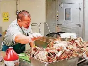  ?? [PHOTO PROVIDED] ?? Turkey is prepared for Thanksgivi­ng meal for the Oklahoma County jail.