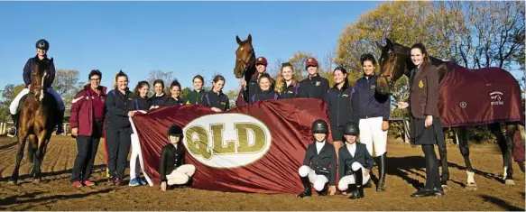  ?? Photo: Kevin Farmer ?? REPRESENTI­NG QUEENSLAND: Darling Downs members of the Queensland interschoo­l equestrian team (from left) Bronte Rigney on AJ, Tracey Sexton (Chef d’Equipe), Piper Wise, Grace de la Croix, Simone Sorensen, Sophie Brennan, Jordon Fenton-Anderson, Holly Hurst, Keeleigh Wise, Chase Naylor holding Ajack, Sarah Coggan, Georgia Rohde, Kate Johnstone, Phoebe Riordan, Tara Wilkinson holding Holly and (front, from left) Isabella Anderson, Bella Ostwald and Josie Ostwald.