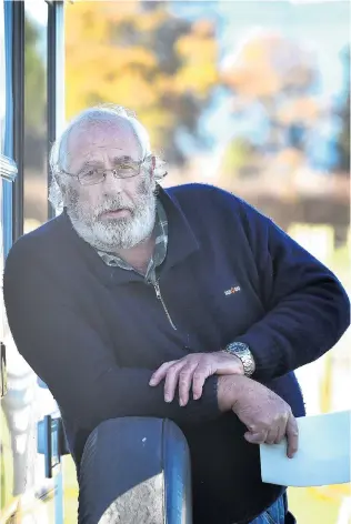  ?? PHOTO: PETER MCINTOSH ?? Battle weary . . . Former Southern Taxis driver Gary Powell stands outside his caravan parked in Mosgiel.