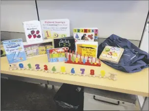 ?? LOANED PHOTO ?? THE YUMA COUNTY LIBRARY DISTRICT is being honored by the National Associatio­n of Counties for creating
Smart Start Kits to help teach toddlers literacy skills. The components of one of the kits is seen at left.