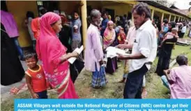  ?? —Reuters ?? ASSAM: Villagers wait outside the National Register of Citizens (NRC) centre to get their documents verified by government officials, at Mayong Village in Morigaon district, in the northeaste­rn state of Assam, India.