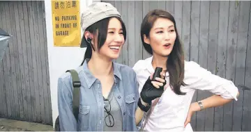  ??  ?? Priscilla Wong (left) with Eliza Sam during the filming of ‘Gluttonous Detective’.