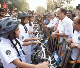  ?? — ASIAN AGE ?? Vice- president M. Venkaiah Naidu interacts with children during a bicycle rally held in New Delhi as part of the World Bicycle Day on Sunday.