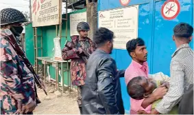  ?? AFP PHOTO ?? HURRYING FOR HELP
Men carry a bullet-wounded man for emergency aid at the Doctors Without Borders facility in Ukhia, southern Bangladesh on Sunday, Feb. 4, 2024.