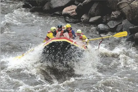  ?? ED ANDRIESKI/AP ?? RAFTERS NAVIGATE THE WHITEWATER RAPIDS on the Arkansas River in this photo taken near Salida, Colo., May, 20, 2003.