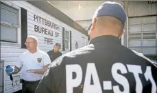  ?? Steph Chambers/Post-Gazette ?? Jim Eaborn instructs members with Pennsylvan­ia Strike Team 1 about hazmat safety Saturday at the Pittsburgh Public Safety Warehouse in the Strip District. PA-ST1 is the largest of the Pa. Urban Search and Rescue teams, and they are readying in case...