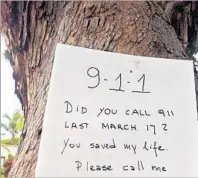  ??  ?? A FLIER on a tree near the Hollywood intersecti­on seeking the good Samaritan who saved a former judge’s life.