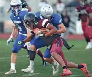  ?? Hassan niblet ?? A Gordon Central defender tackles a Utopian Academy running back during the Warriors’ spring game Thursday night at Ratner Stadium.