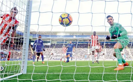  ?? — AP ?? 1 1 Stoke City goalkeeper Jack Butland’s fumble conceded an own goal in their English Premier League match against Leicester City at the King Power Stadium in Leicester on Saturday. The match ended 1-1.