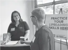  ?? ROSIE MULLALEY/THE TELEGRAM ?? Andrea Augot (left), who has profound hearing loss, and helps teach lipreading at the Canadian Hard of Hearing Associatio­n-newfoundla­nd and Labrador, was at the launch of its online lipreading course, Read Our Lips, Thursday at the St. John’s Farmers’ Market.