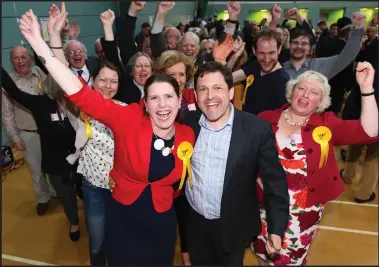  ??  ?? Jo Swinson and her supporters celebrate her return to Westminste­r as MP for East Dunbartons­hire