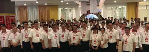  ??  ?? Loke (front row, seventh left) and Chong (front row, eighth left) in a group photo with DAP members during the convention.