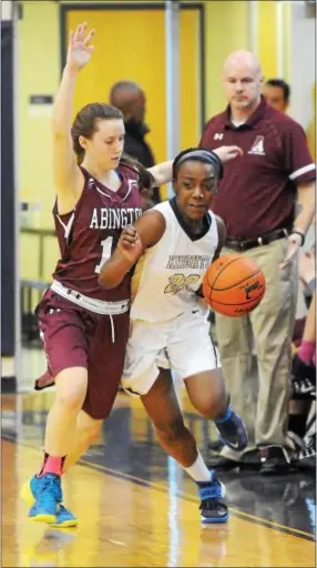  ?? Staff photo by Tom Kelly IV ?? Rustin’s Noelle Powell (22) tries to dribble past Abington’s Sammy Lochner in the first half on Saturday.