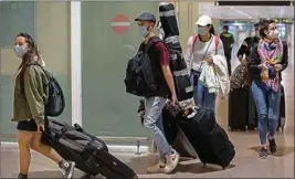  ?? PTI ?? Passengers arrive at the Barcelona airport, Spain