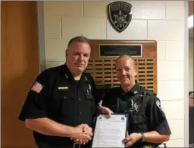  ?? JOHN BREWER — ONEIDA DAILY DISPATCH ?? Acting Madison County Sheriff John Ball commends Deputy Shannon Augustine for her actions in responding to a fatal motor vehicle accident in the Town of Madison on Wednesday, Aug. 16.