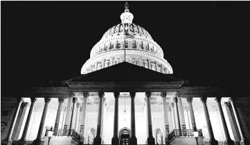  ??  ?? US Capitol is seen shortly after beginning of the government shutdown in Washington. — Reuters photo