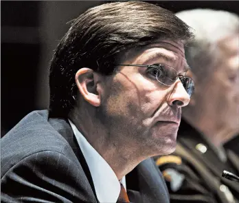  ?? MICHAEL REYNOLDS/AP ?? Defense Secretary Mark Esper testifies during a House hearing Thursday on Capitol Hill in Washington. Gen. Mark Milley, chairman of the Joint Chiefs of Staff, also testified.