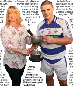  ??  ?? County Board vicechairp­erson Tracey Kennedy, presents the cup to Killavulle­n captain Pa Sheehan