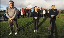  ??  ?? Castleisla­nd Members’ Golf Club 2020 President Willie Galvin (left) with captains Marian Kerrisk and Brendan Mullins against a backdrop of supportive club members at their drive-in back in January