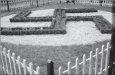  ?? NEW YORK CITY MUNICIPAL ARCHIVES VIA AP ?? In this May 22, 1938, photo provided by the New York City Municipal Archives, a large swastika is surrounded by a white picket fence at Camp Siegfried in Yaphank, N.Y. The enclave of former summer bungalows, where Nazi sympathize­rs once proudly marched...