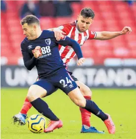  ?? Photo / AP ?? Ryan Fraser (left) and United’s George Baldock vie for the ball.