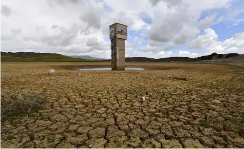  ?? AFP ?? A picture taken on April 4, 2023 shows the dry Chiba dam near the city of Korba in northeaste­rn Tunisia. The North African country’s dams are at critical lows following years of drought, exacerbate­d by pipeline leaks in a decrepit distributi­on networK.
