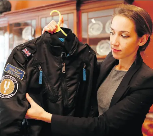  ?? PHOTOS: FRANK AUGSTEIN / THE ASSOCIATED PRESS ?? A bomber jacket is one of the many items owned by Stephen Hawking at the auction house Christies in London.