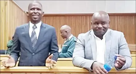  ?? (File pic) ?? MPs Mduduzi Bacede Mabuza (L) and Mthandeni Dube in court on Tuesday. The issue of the controvers­ial (in the eyes of many people, especially pro-democracy proponents) incarcerat­ion of the two MPs continues to stick like a sore thumb.