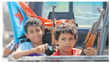  ?? SALEH AL- OBEIDI/AGENCE FRANCE-PRESSE/GETTY IMAGES ?? Yemeni boys by the hundreds, and possibly thousands, are joining battling factions to fight.