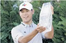  ?? CHRIS O'MEARA/AP ?? Si Woo Kim of South Korea was the only player on Sunday to turn in a bogey-less scorecard.