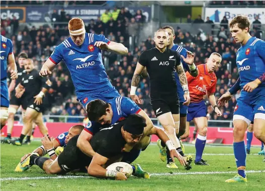  ?? PICTURES: Getty Images ?? Hat-trick hero: Rieko Ioane dives over to score one of his three for New Zealand