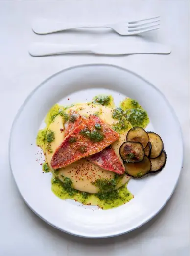  ??  ?? RED MULLET, ROCKET
AND BASIL PESTO WITH AUBERGINE AND POLENTA Sumptuous, silky polenta and crispy aubergine make this a fish dish full of comfort. F&T WINE MATCH
Dark berries and fragrant fresh notes (eg 2016
El Castro de Valtuille Mencía Joven,...