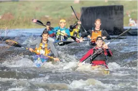  ?? PICTURE: JOHN HISHIN/ GAMEPLAN MEDIA ?? HOLDING ON: In the hustle and bustle of the start, Team Bamboo Warehouse’s Graeme Solomon (right) and Adrian Boros (left) got themselves an early lead on stage one of the 2018 Berg River Canoe Marathon yesterday.